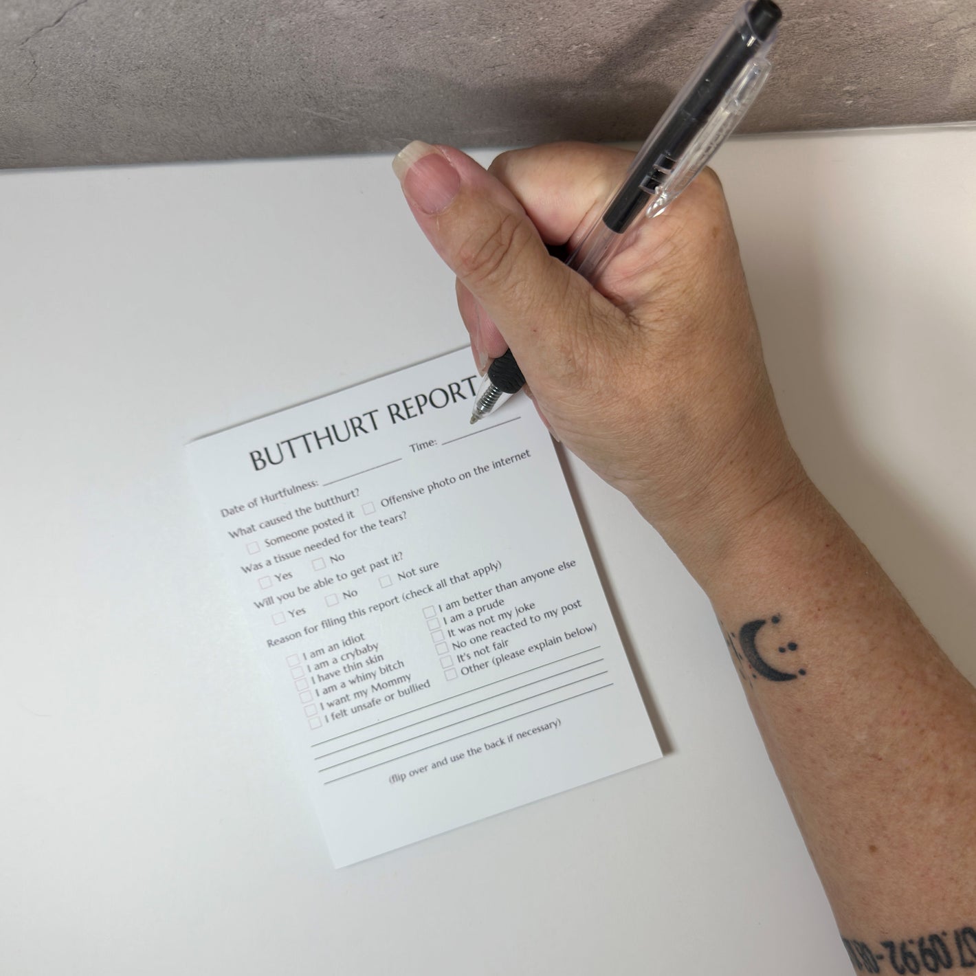 Funny and playful Butthurt Report notepad with sarcastic checkboxes, perfect for office humor, adult gag gifts, or playful workplace fun