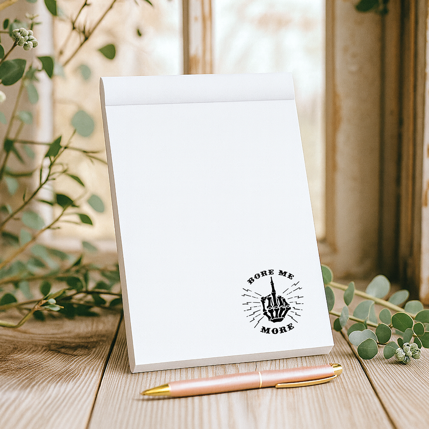Fun and playful notepad with cheeky middle finger design and “Bore Me More” phrase, perfect for sassy stationery lovers and gag gift ideas