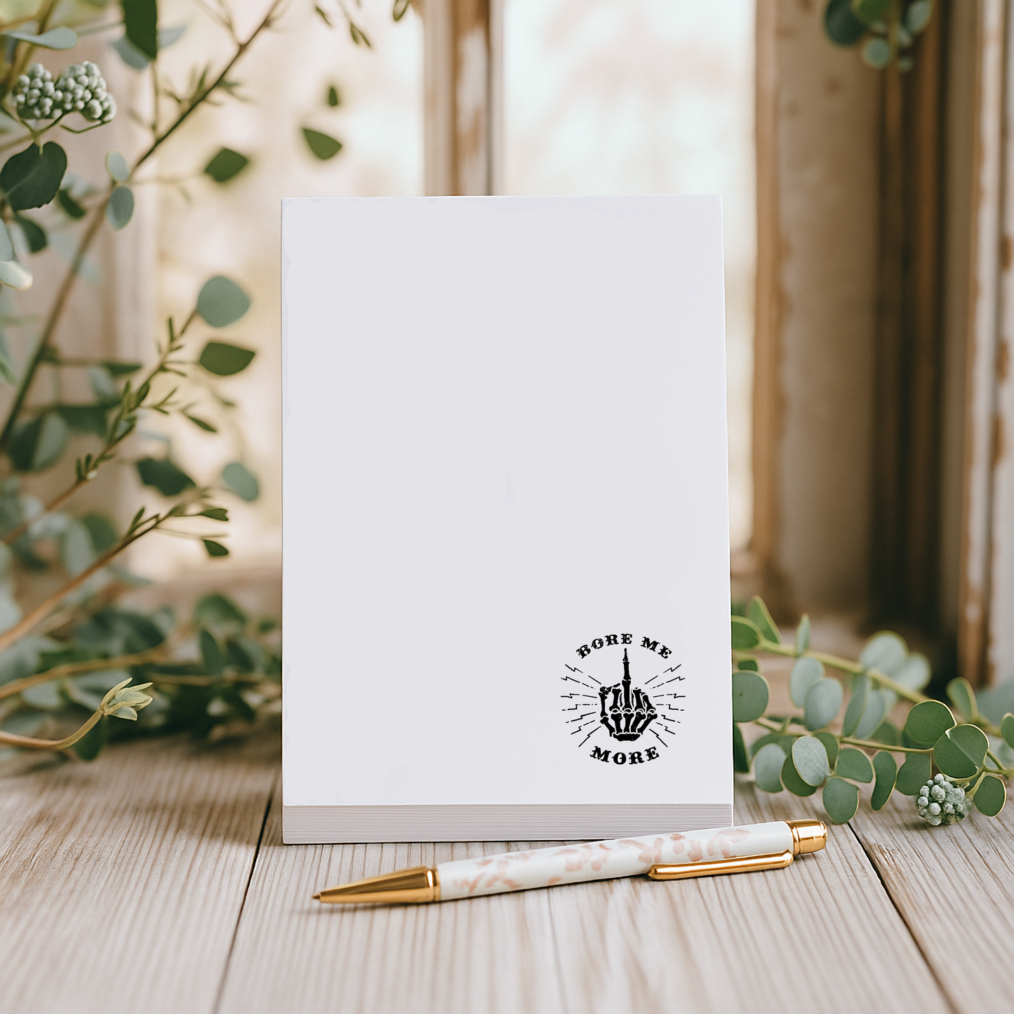 Fun and playful notepad with cheeky middle finger design and “Bore Me More” phrase, perfect for sassy stationery lovers and gag gift ideas