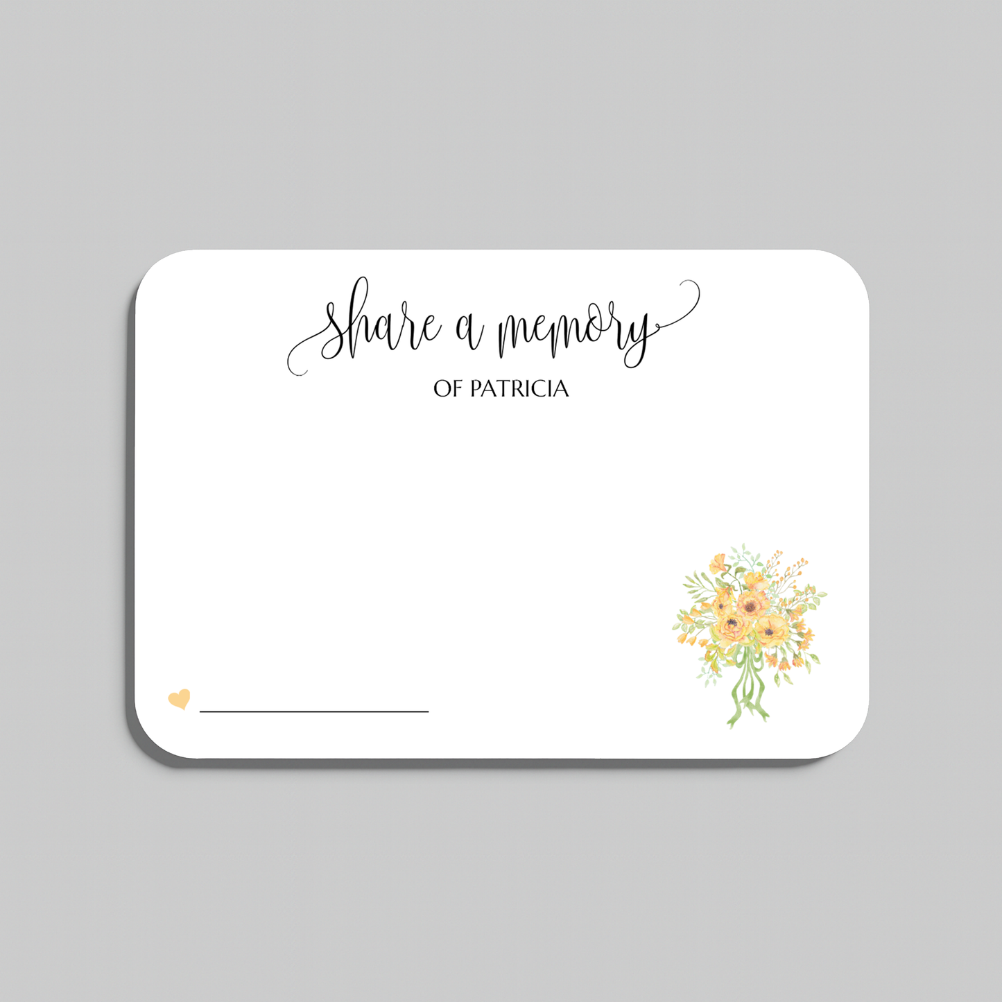 A white rectangular memorial card with rounded corners, printed with the words share a memory in black script and serif text, a small yellow heart near the lower left, a blank line for writing, and a small watercolor bouquet of yellow and peach flowers in the lower right. The card is centered on a light gray background.