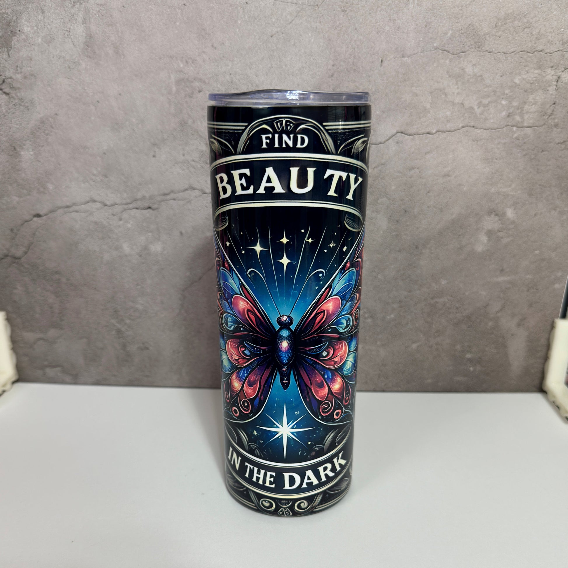 20oz skinny tumbler with vibrant butterfly art and “Find Beauty in the Dark” quote

