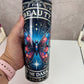 Tumbler with butterfly design and text 'Find Beauty in the Dark' held by a hand.