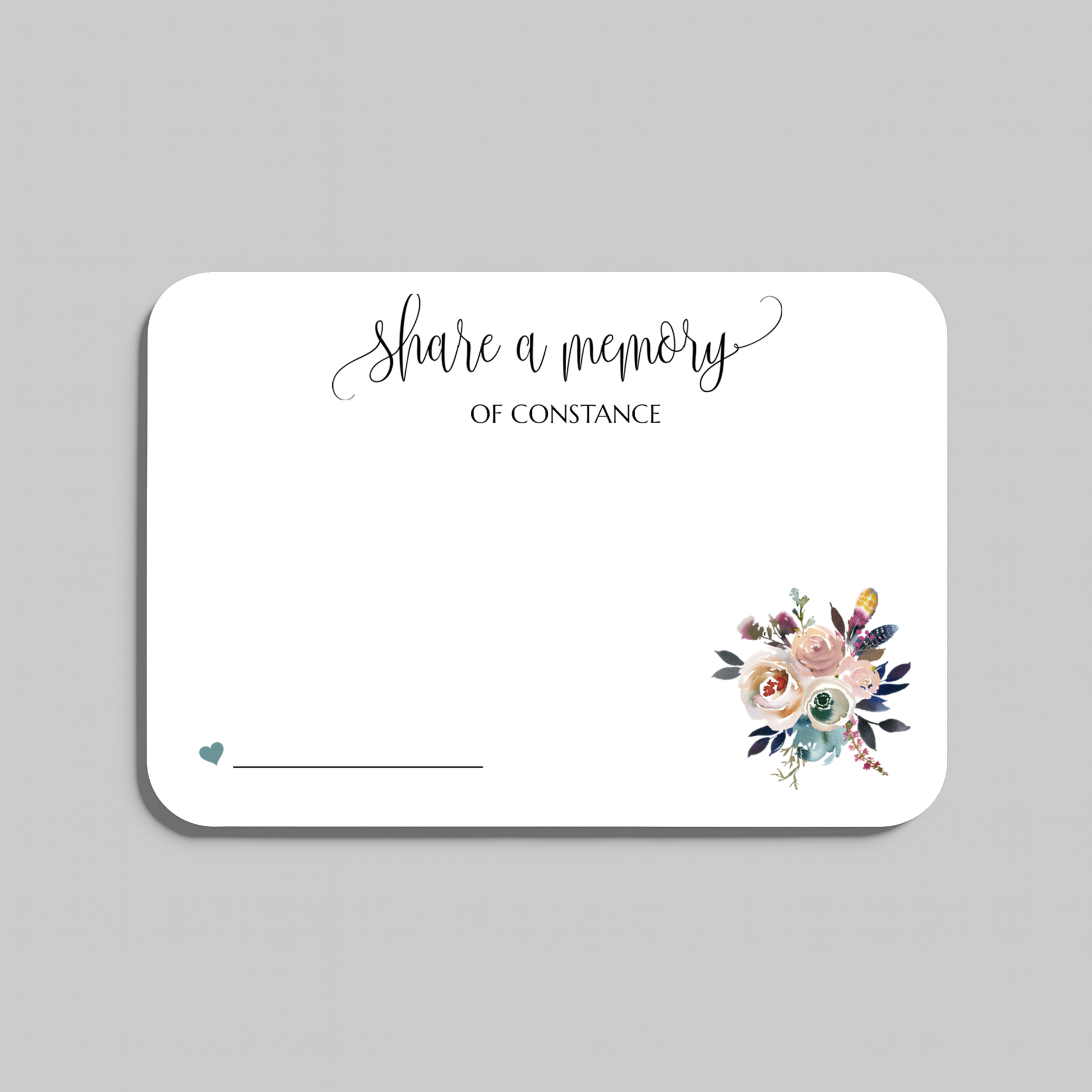 A rectangular white wedding reception seating card with rounded corners, featuring the script text share a memory at the top, a small teal heart and line at the bottom left, and a watercolor floral bouquet illustration at the bottom right. The card is shown on a neutral gray background.