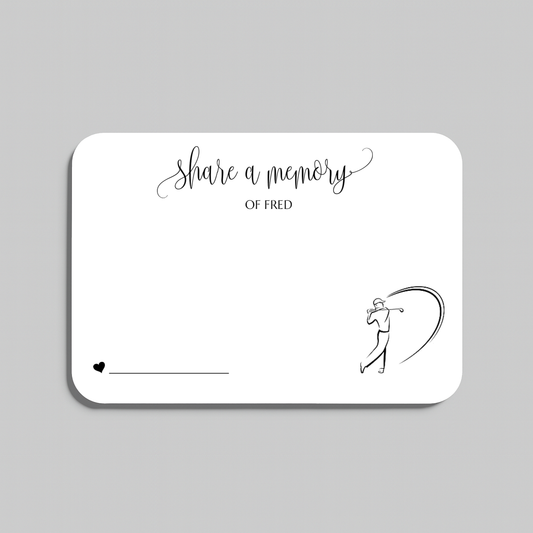 A white rectangular memorial card with rounded corners, featuring the printed text 'share a memory' in black script and serif fonts, along with a simple black line drawing of a person holding a golf club. The card is shown on a light gray background.
