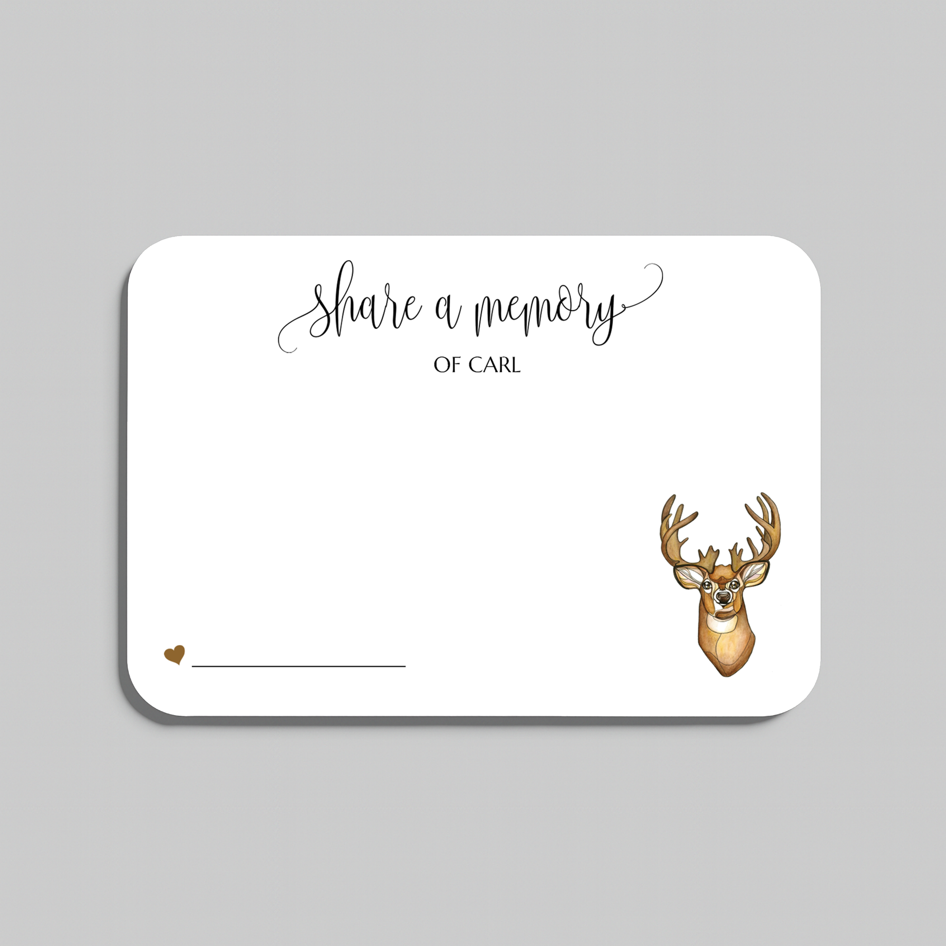A white rectangular memorial card with rounded corners, printed with the words 'share a memory' in black script and serif text, plus a small brown deer head illustration and a line for writing, shown on a light gray background.