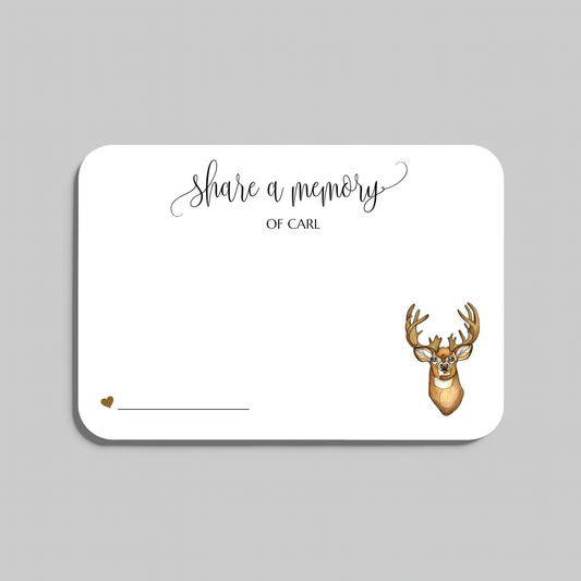A white rectangular memorial card with rounded corners, printed with the words 'share a memory' in black script and serif text, plus a small brown deer head illustration and a line for writing, shown on a light gray background.