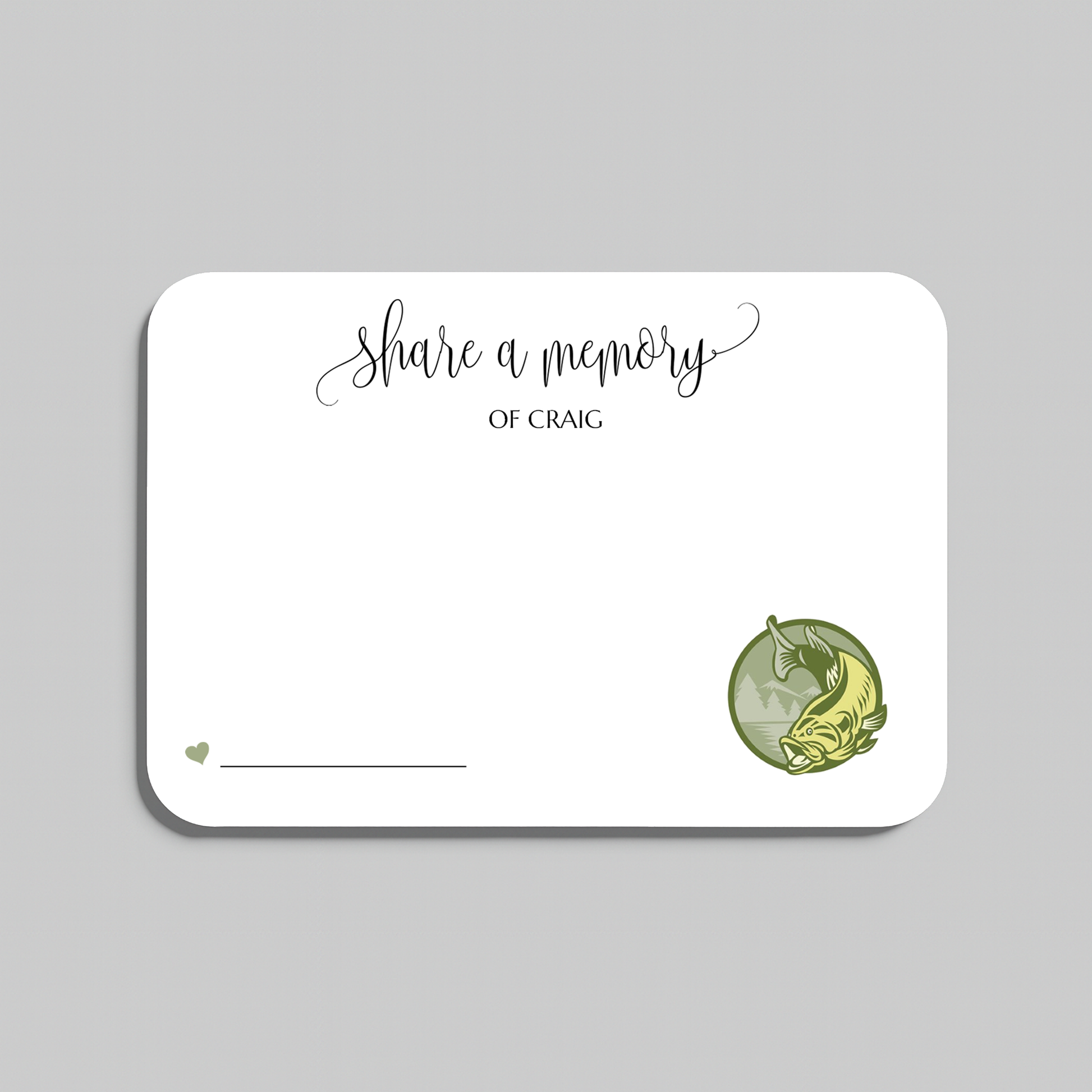 A white rectangular memorial card with rounded corners, featuring the printed text 'share a memory' in black script and serif type, a small heart and line in the lower left, and a green circular illustration of a bass fish in the lower right. The card is centered on a light gray background.