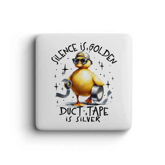 Yellow duck wearing sunglasses and a cap holding duct tape with the quote “Silence is golden, duct tape is silver” on a fun magnet