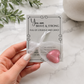 Inspirational pocket hug keepsake with a heart-shaped token on a "You Are Brave & Strong" encouragement card, a thoughtful comfort gift for friends, family, coworkers, or anyone needing support Packaged in a small organza bag and placed inside a cellophane sleeve for easy gift giving.